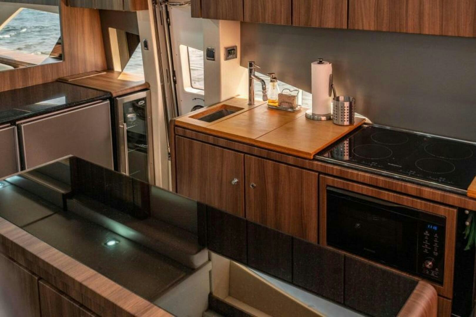 a kitchen with a stove and cabinets aboard AQUABELLA Yacht for Sale