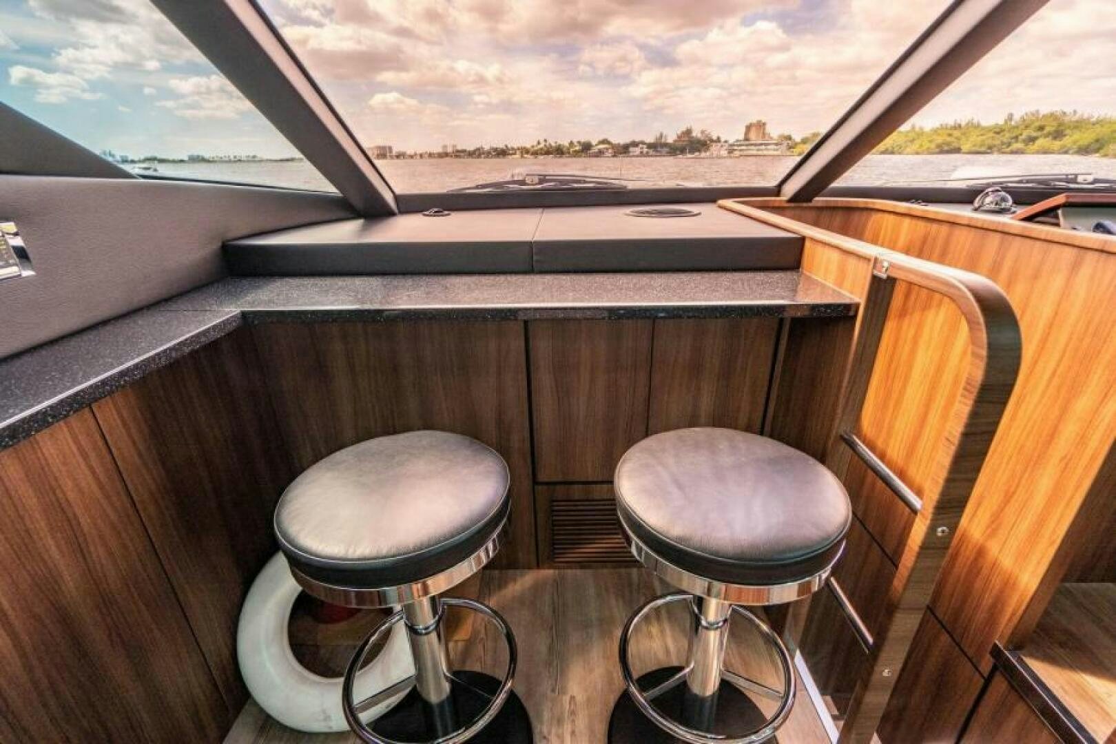 a couple stools on a boat aboard AQUABELLA Yacht for Sale