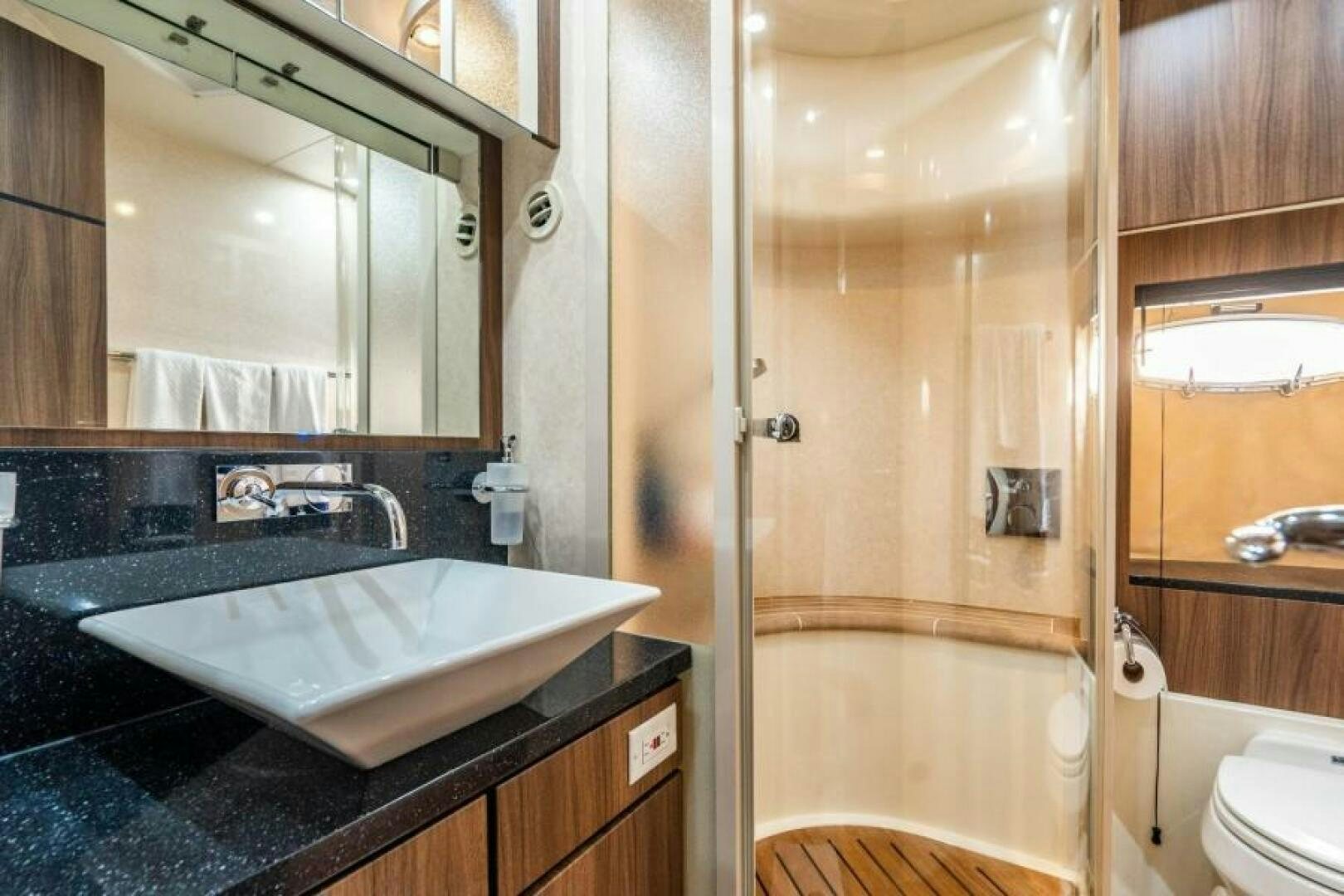 a bathroom with a glass shower aboard AQUABELLA Yacht for Sale