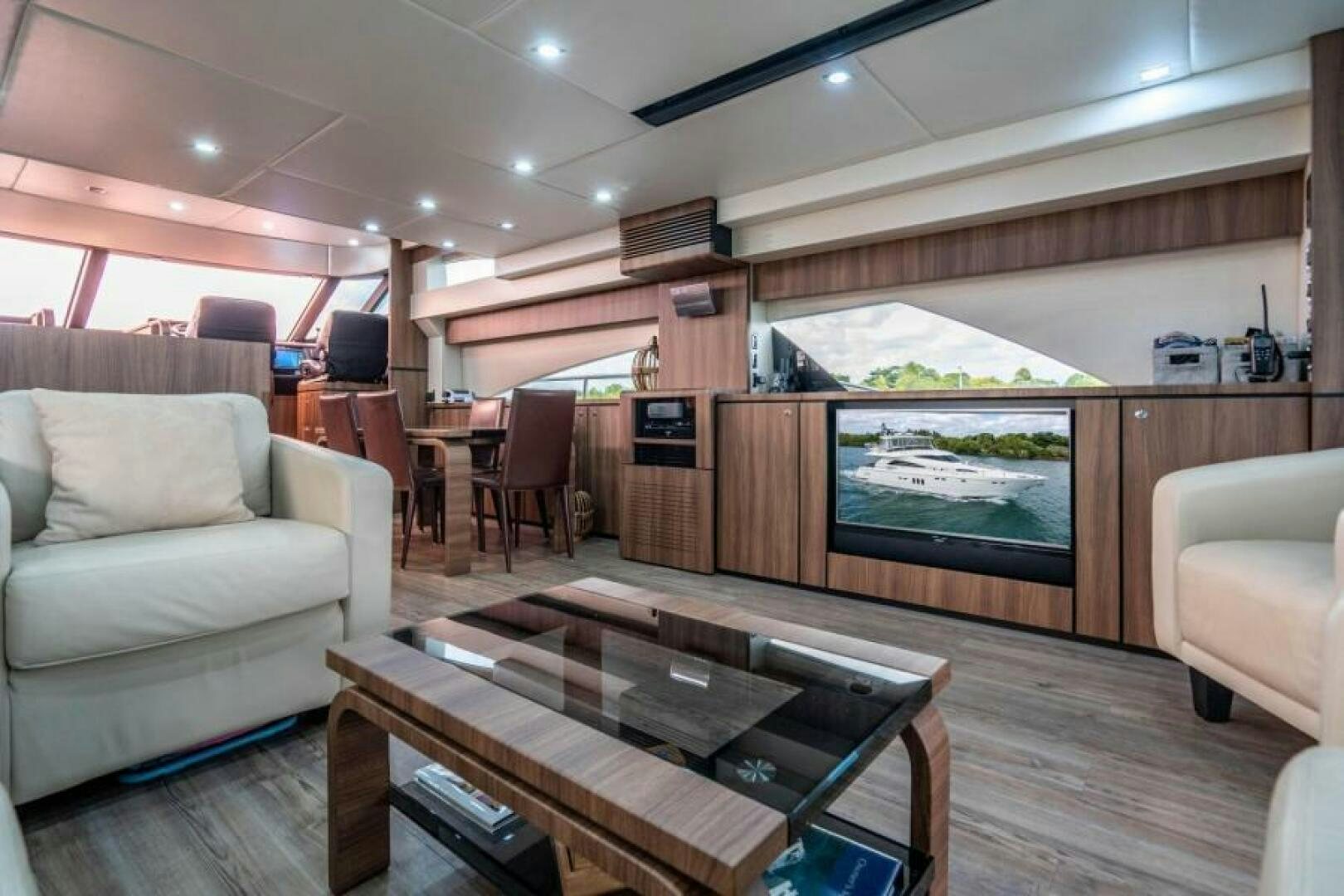 a living room with a large television aboard AQUABELLA Yacht for Sale