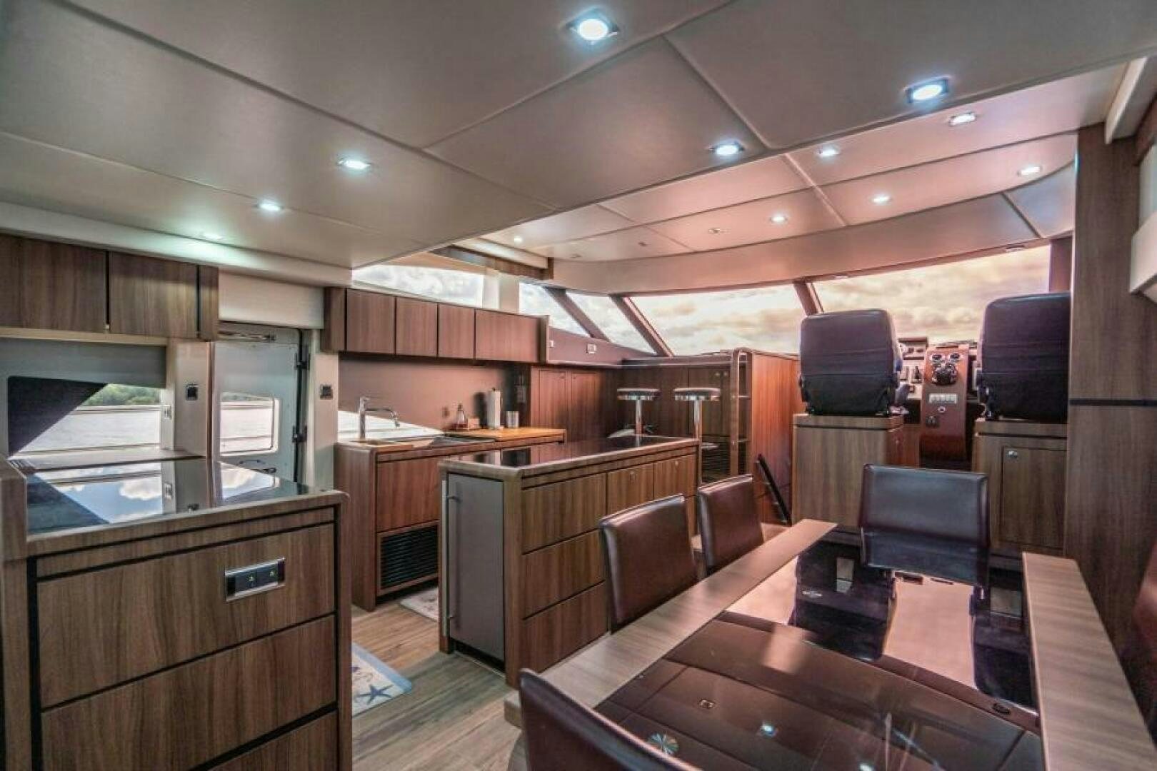 a large kitchen with wooden cabinets aboard AQUABELLA Yacht for Sale