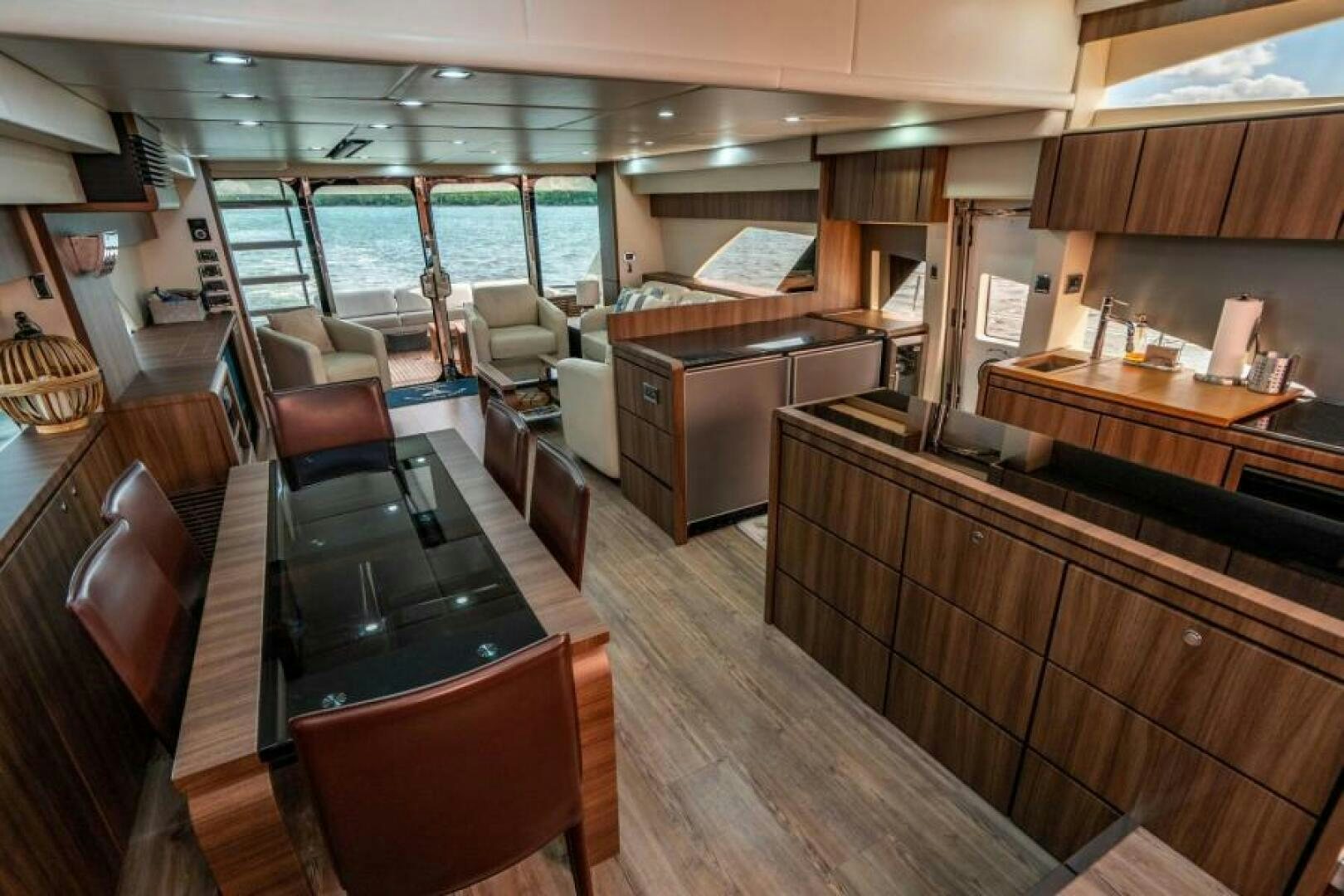 a kitchen with wooden cabinets aboard AQUABELLA Yacht for Sale