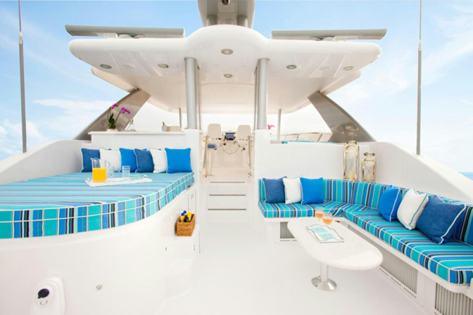 a large white ship with blue seats aboard HANNAH Yacht for Sale