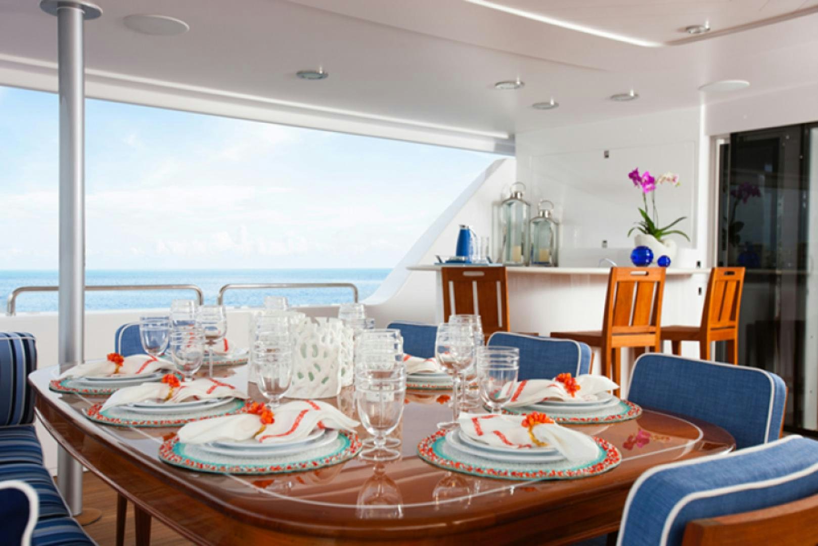 a dining room with a table set for a meal aboard HANNAH Yacht for Sale
