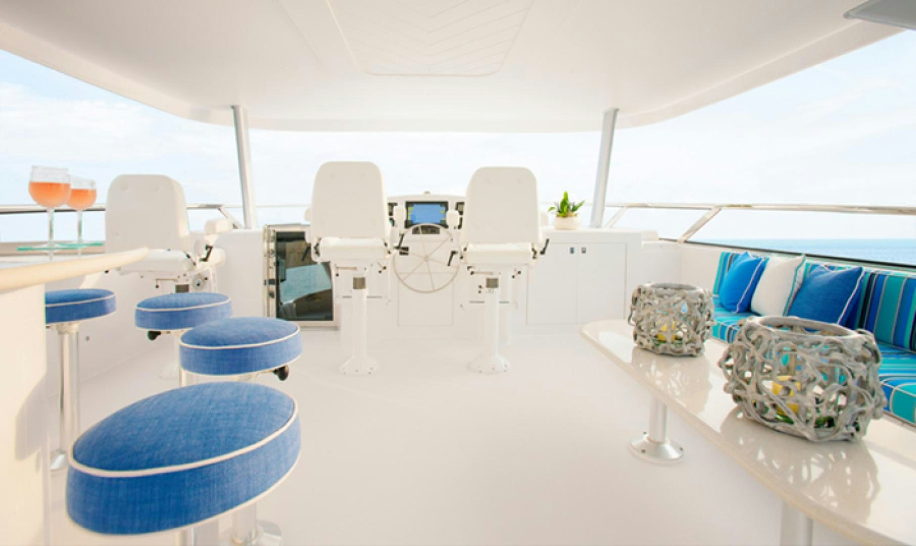 a white tent with blue chairs and white tables aboard HANNAH Yacht for Sale