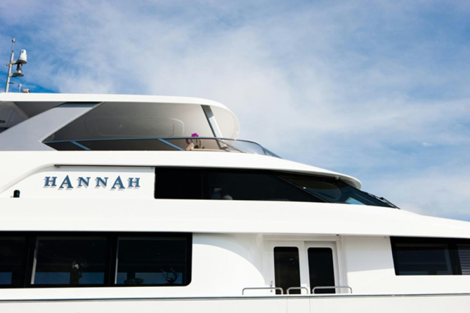 a white car with a person inside aboard HANNAH Yacht for Sale