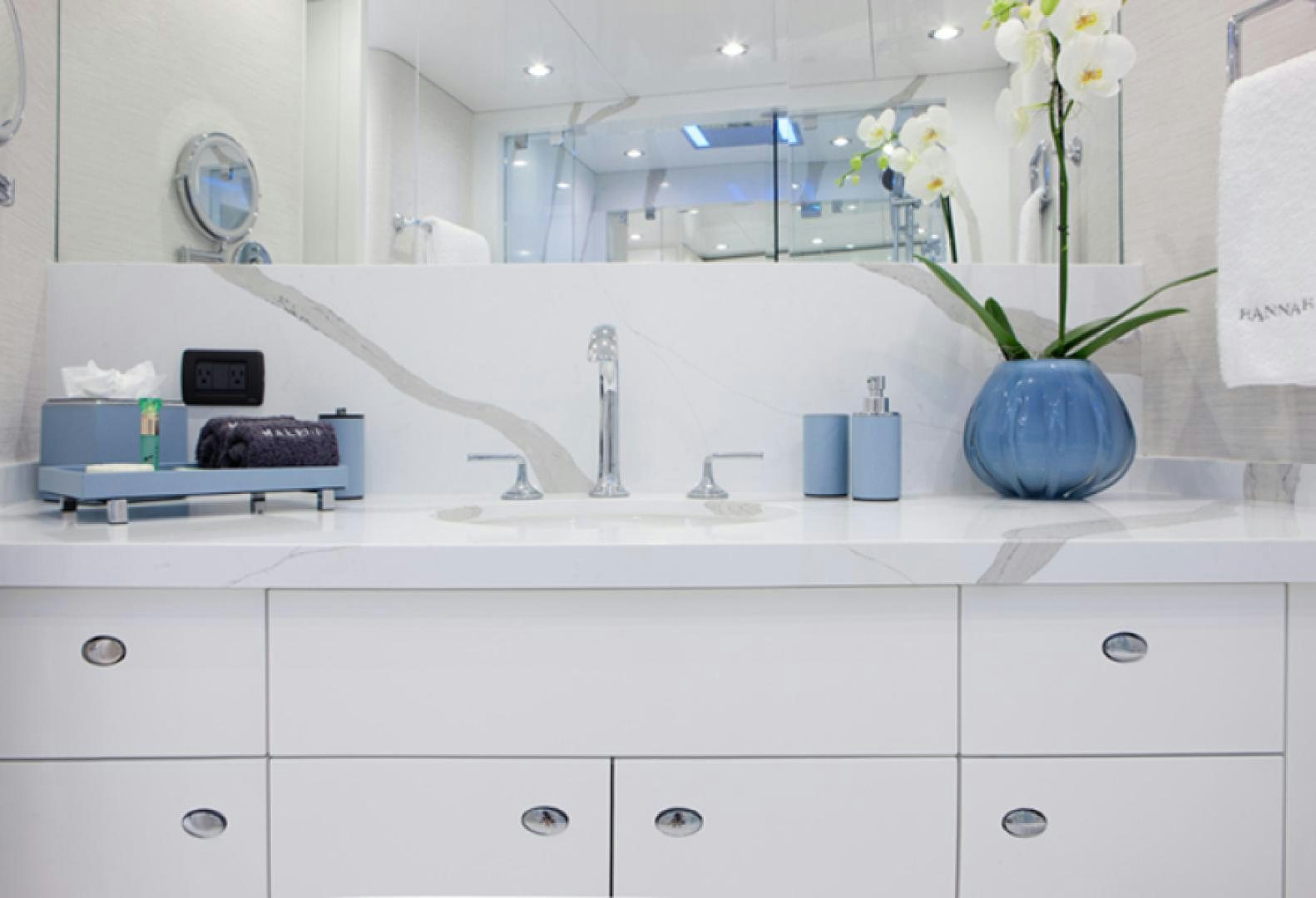 a bathroom with white cabinets aboard HANNAH Yacht for Sale
