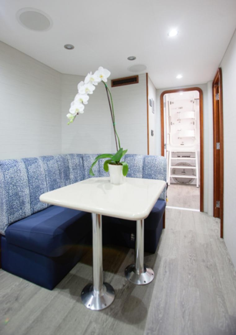 a table with flowers on it aboard HANNAH Yacht for Sale