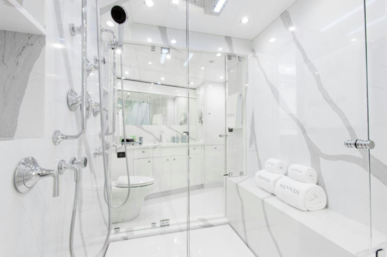 a bathroom with a glass shower aboard HANNAH Yacht for Sale