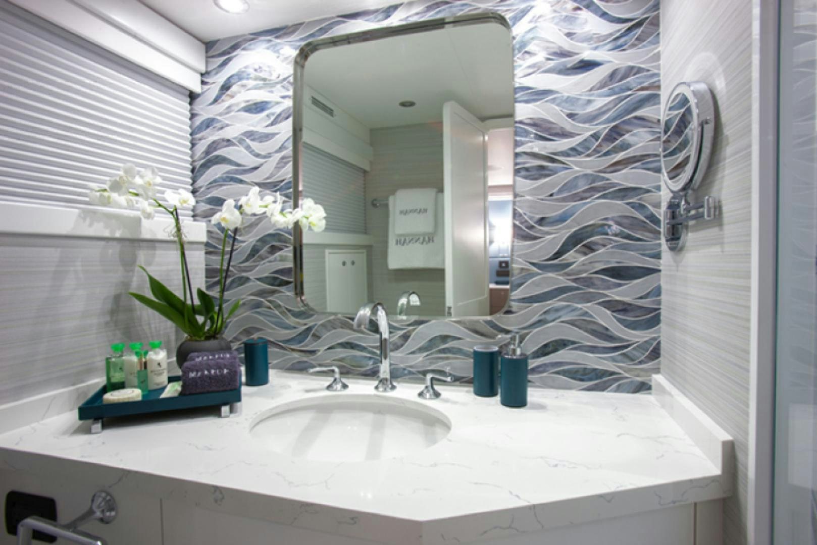 a bathroom with a large mirror aboard HANNAH Yacht for Sale