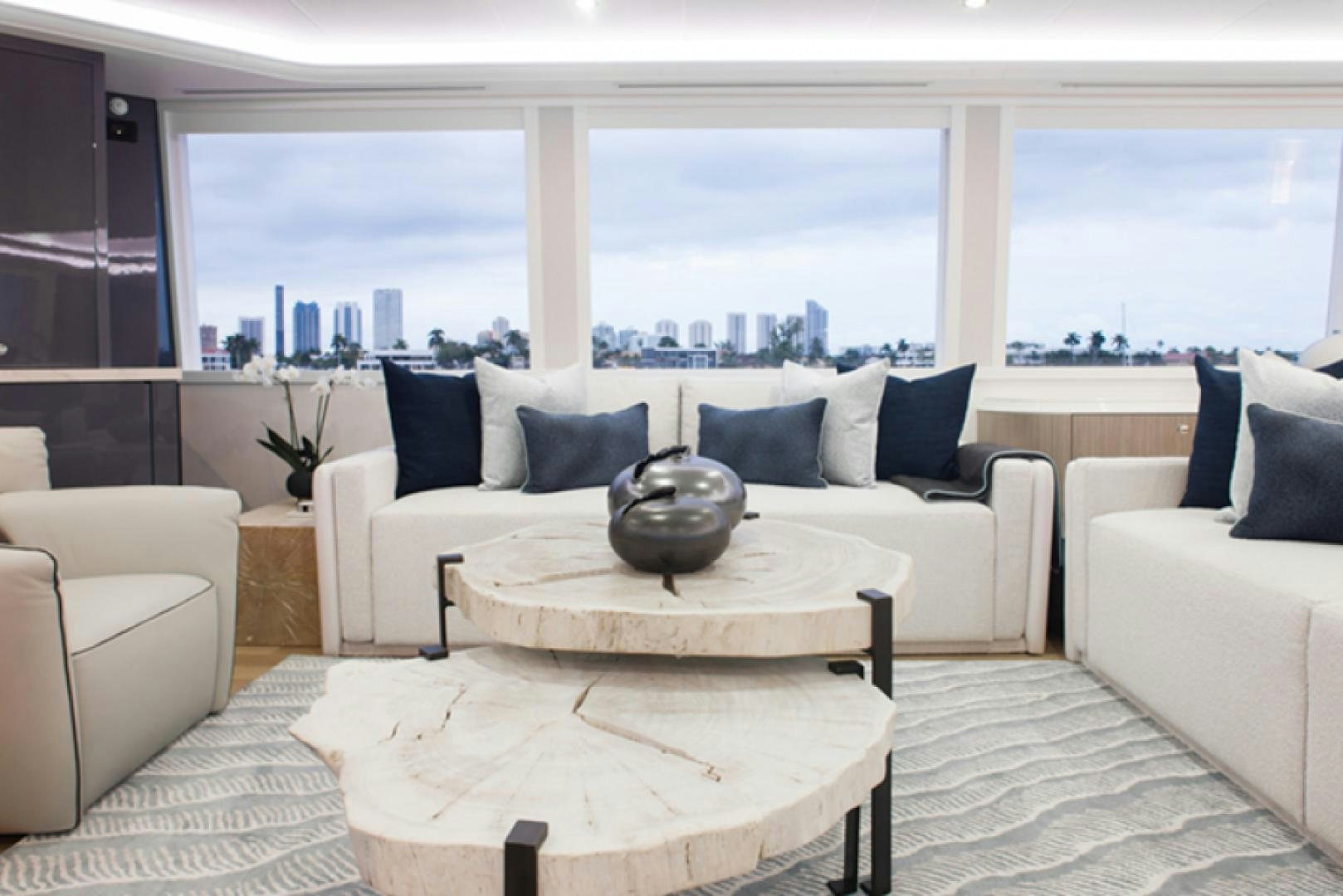 a living room with a large window aboard HANNAH Yacht for Sale