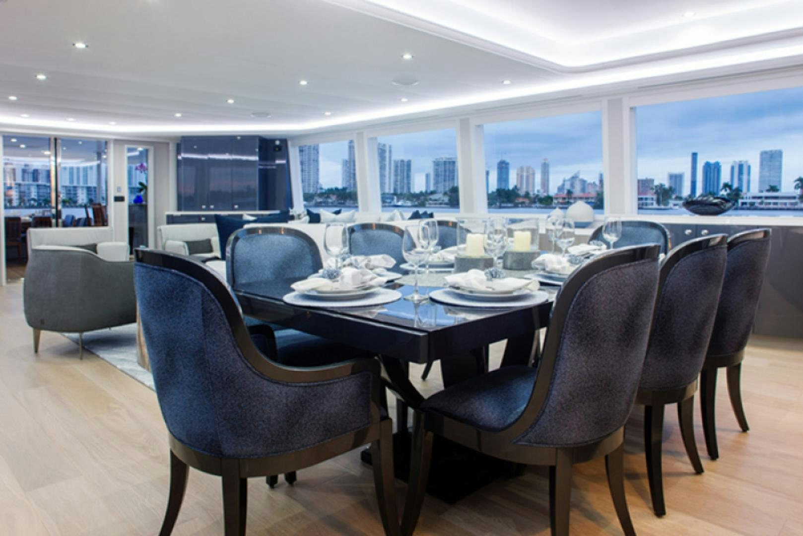 a table with chairs around it aboard HANNAH Yacht for Sale