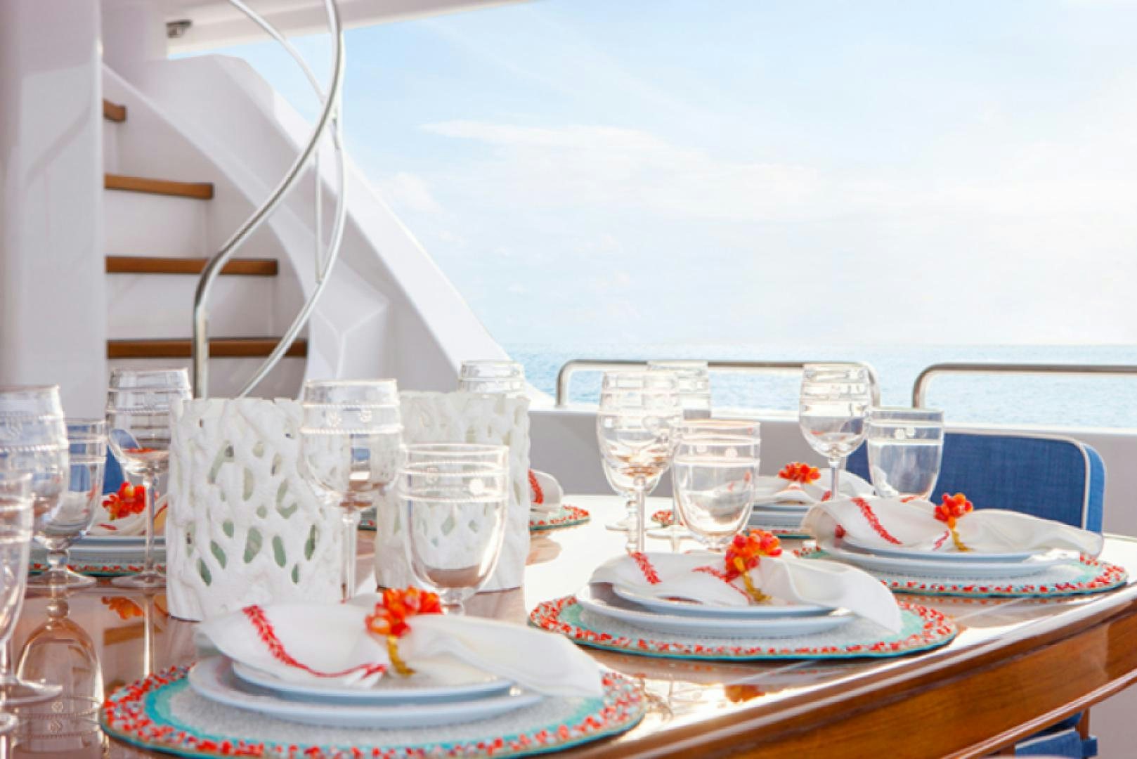 a table with plates and glasses aboard HANNAH Yacht for Sale