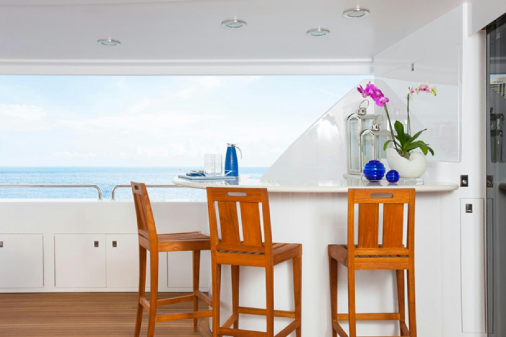 a kitchen with a table and chairs aboard HANNAH Yacht for Sale