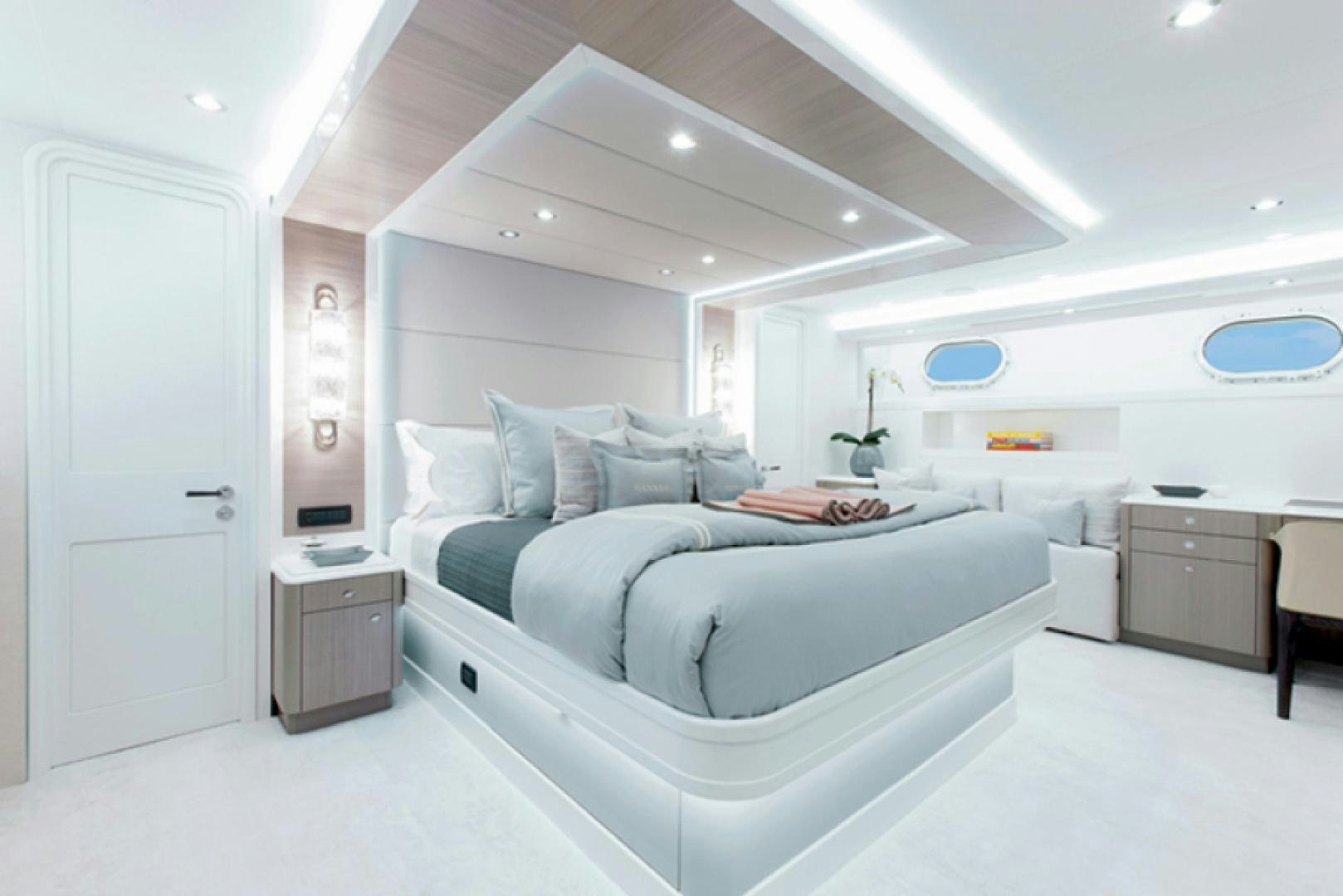 a room with a bed and a desk aboard HANNAH Yacht for Sale