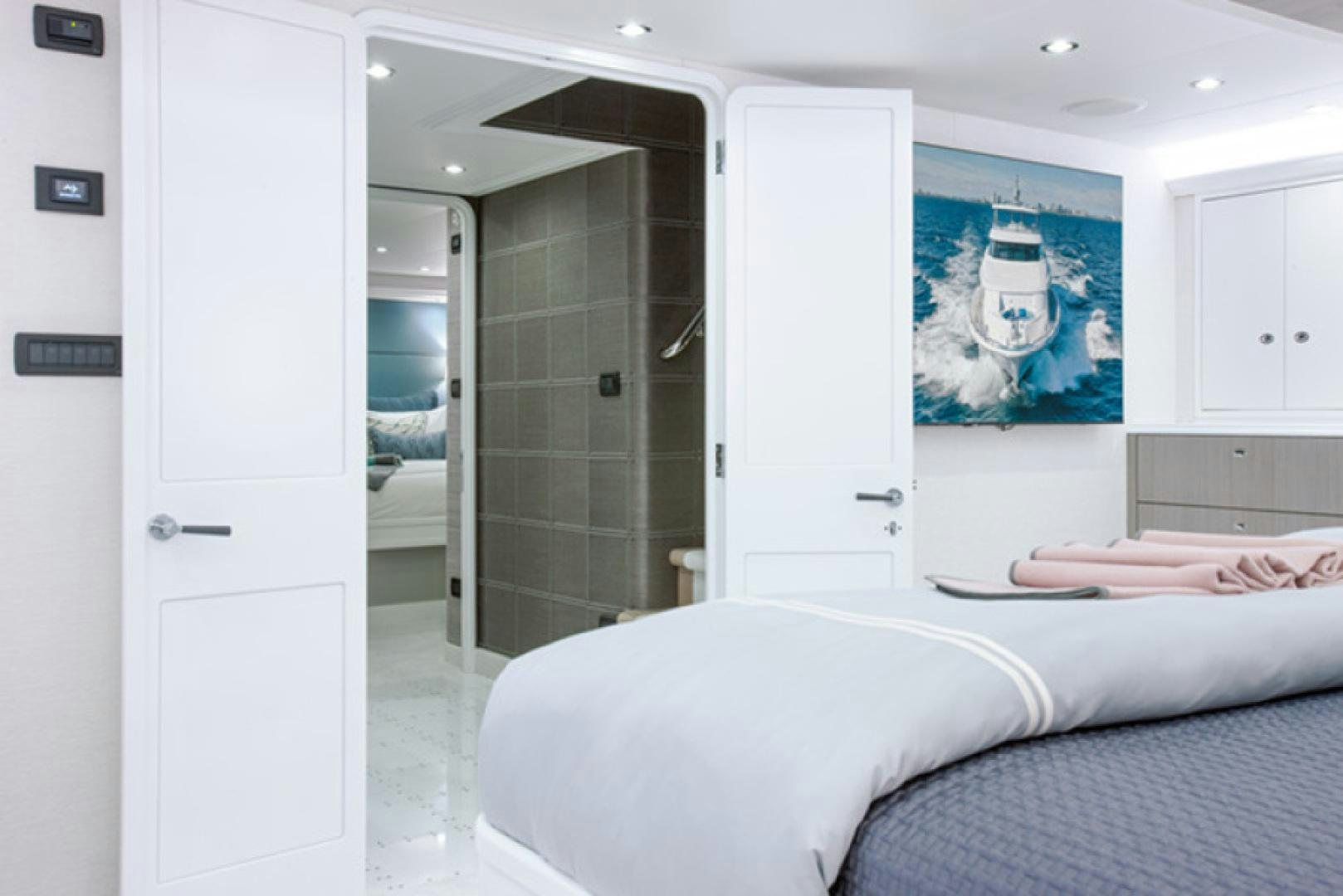 a room with a bed and a door aboard HANNAH Yacht for Sale