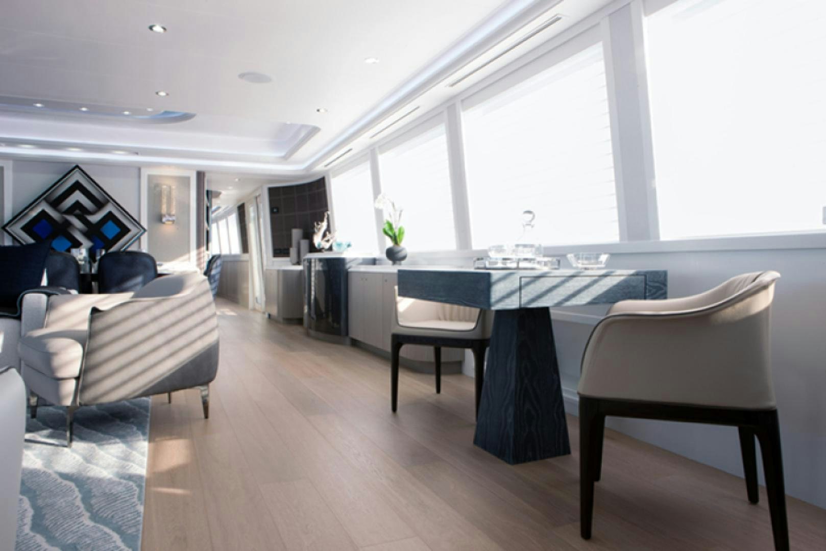 a room with a table chairs and a large window aboard HANNAH Yacht for Sale