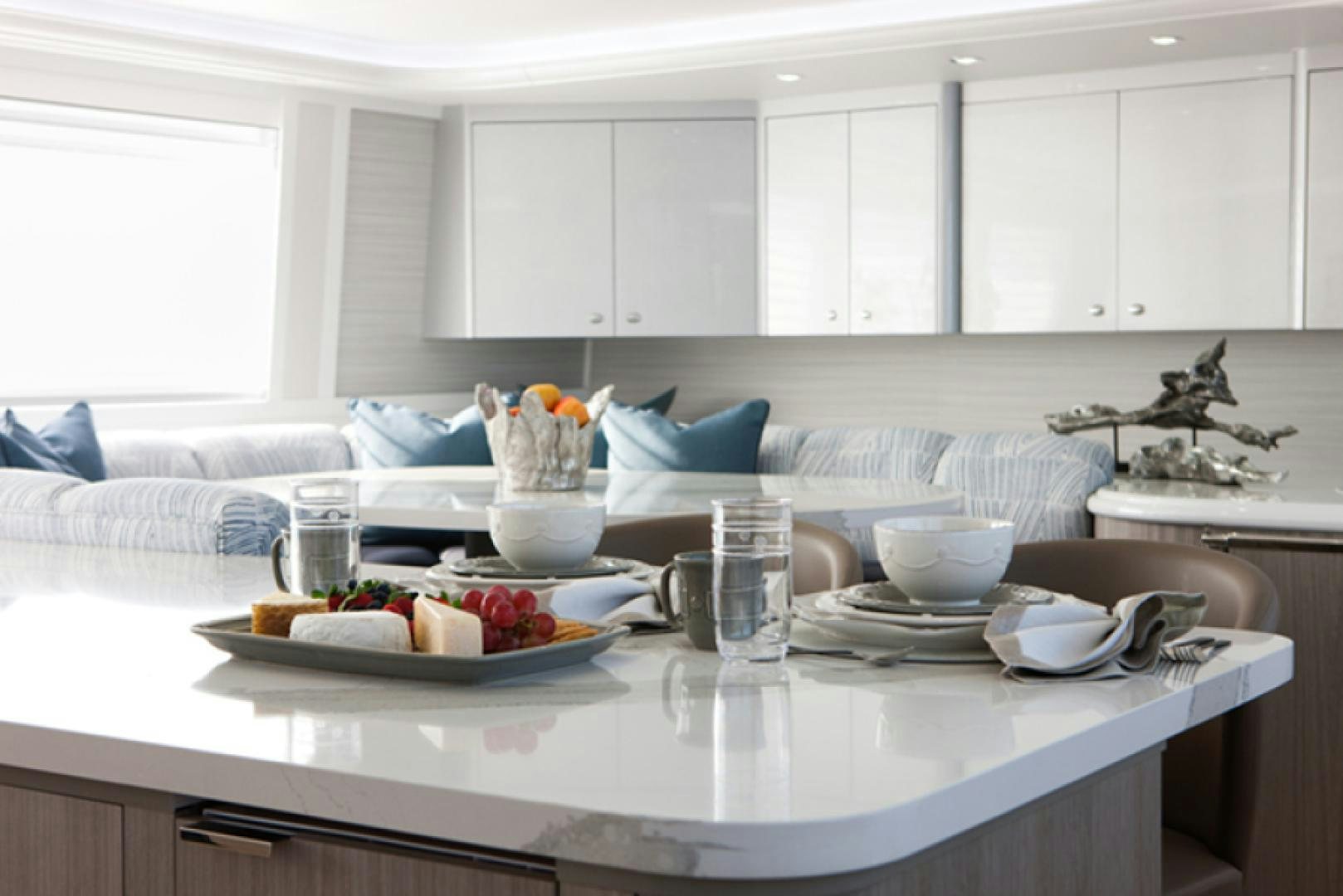 a kitchen with white cabinets aboard HANNAH Yacht for Sale