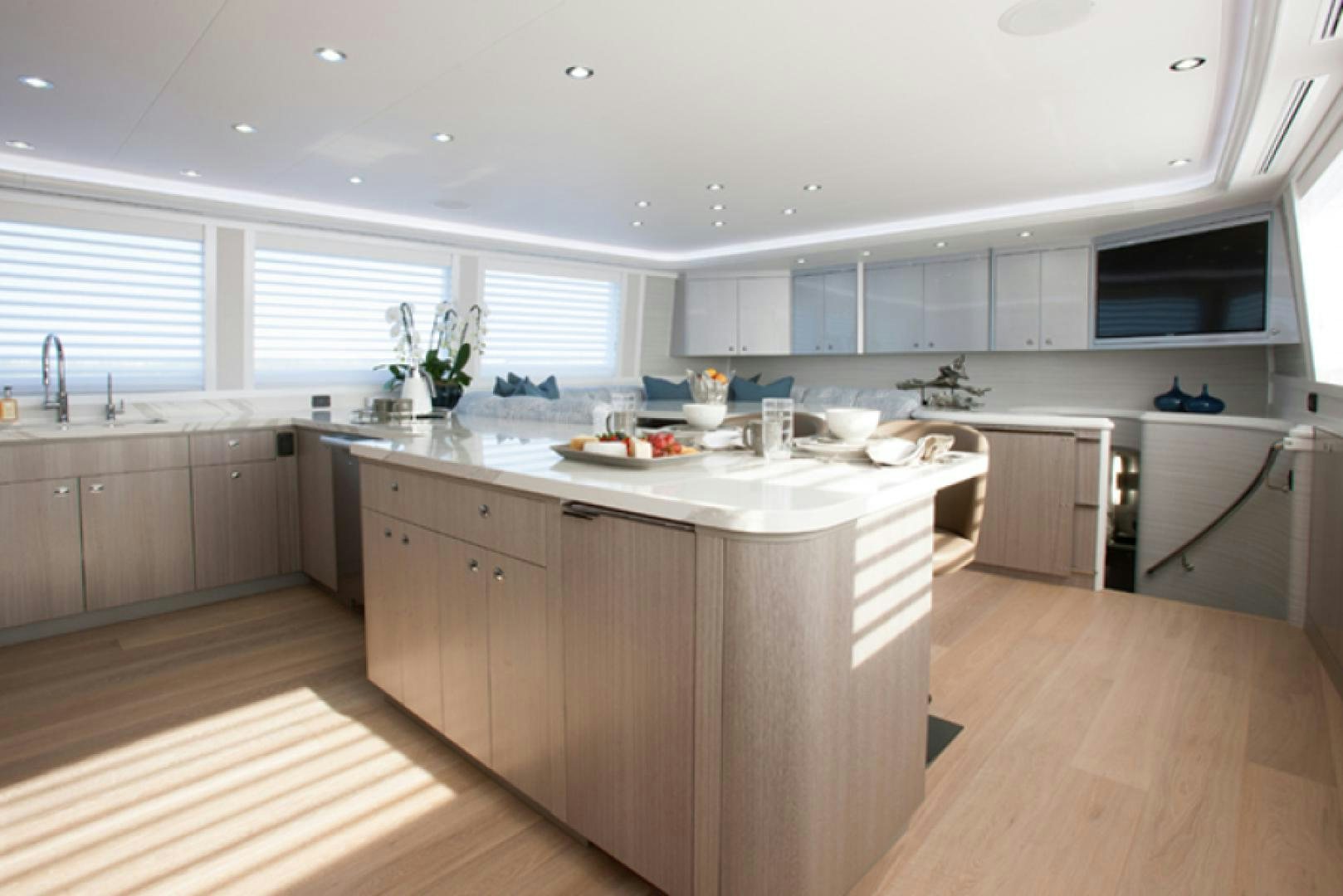 a kitchen with white cabinets aboard HANNAH Yacht for Sale