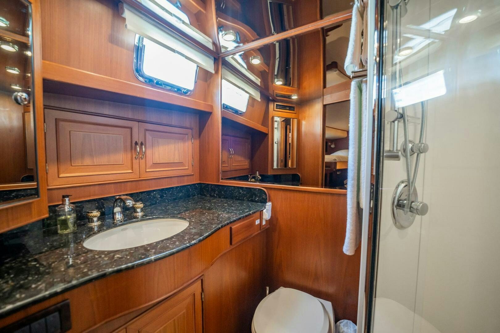 a bathroom with a sink and a mirror aboard BEBA Yacht for Sale