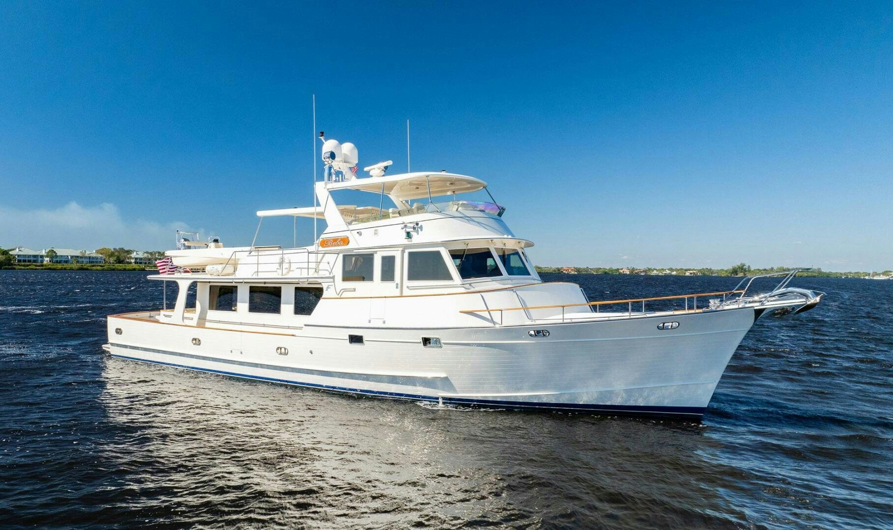 a white boat on the water aboard BEBA Yacht for Sale