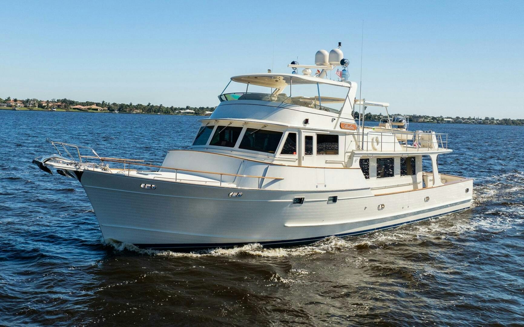 a white boat on the water aboard BEBA Yacht for Sale