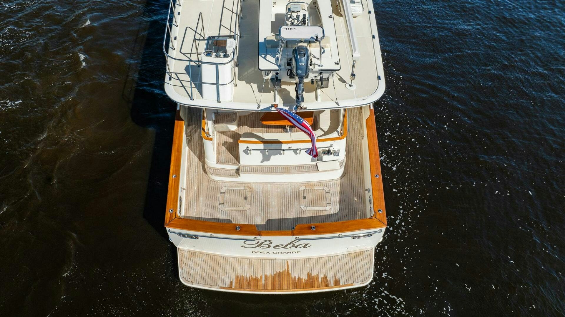 a white and orange boat on water aboard BEBA Yacht for Sale