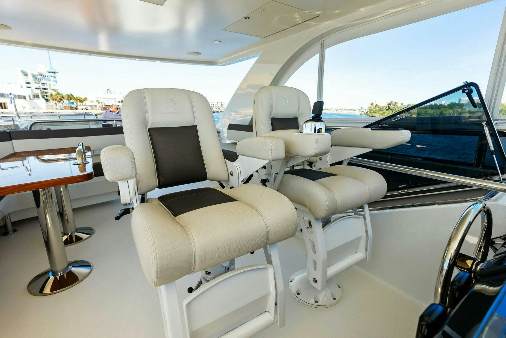 a boat with a seat and a table and chairs aboard SUNNY SEAJAY Yacht for Sale