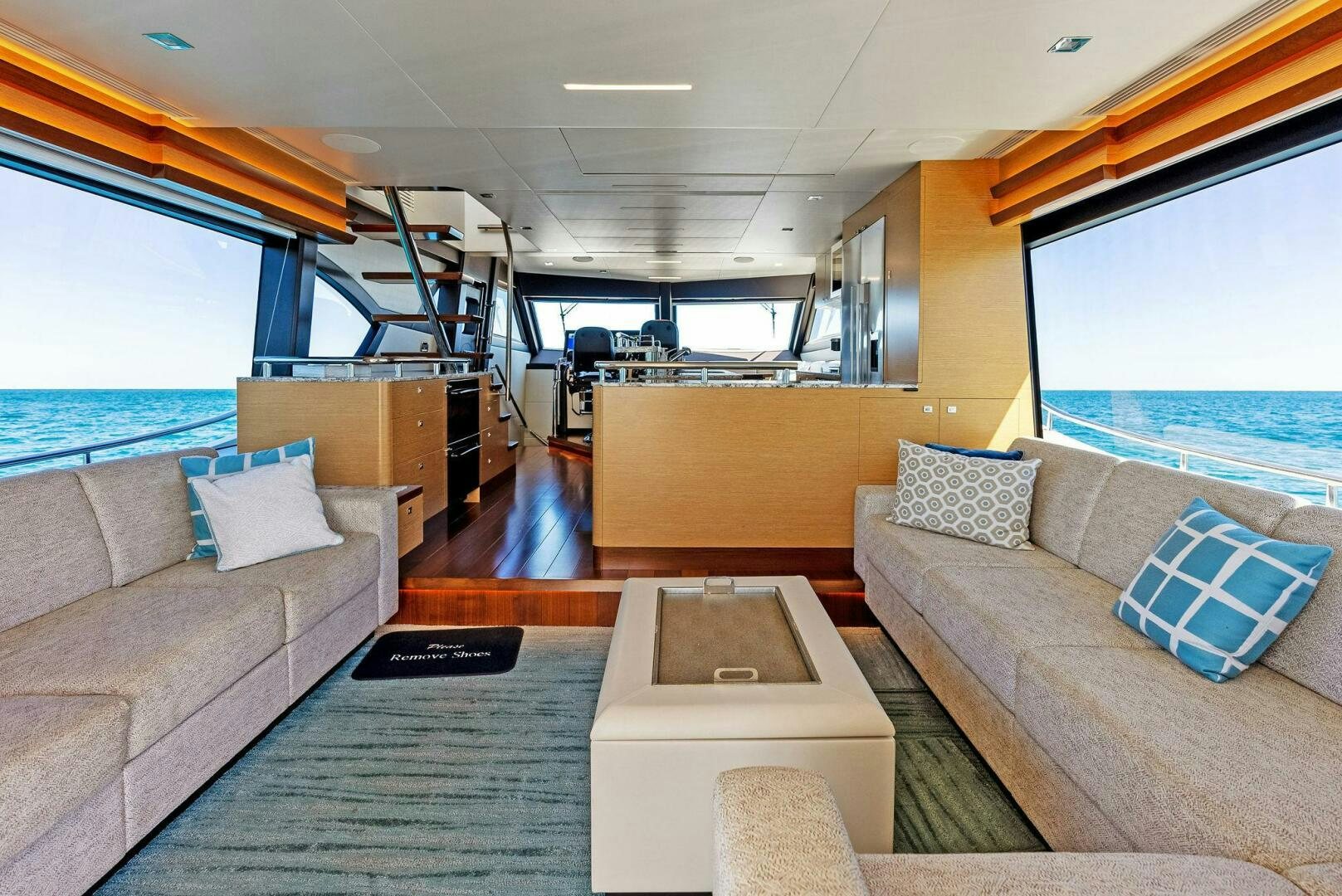 a living room with a couch and a table aboard SUNNY SEAJAY Yacht for Sale