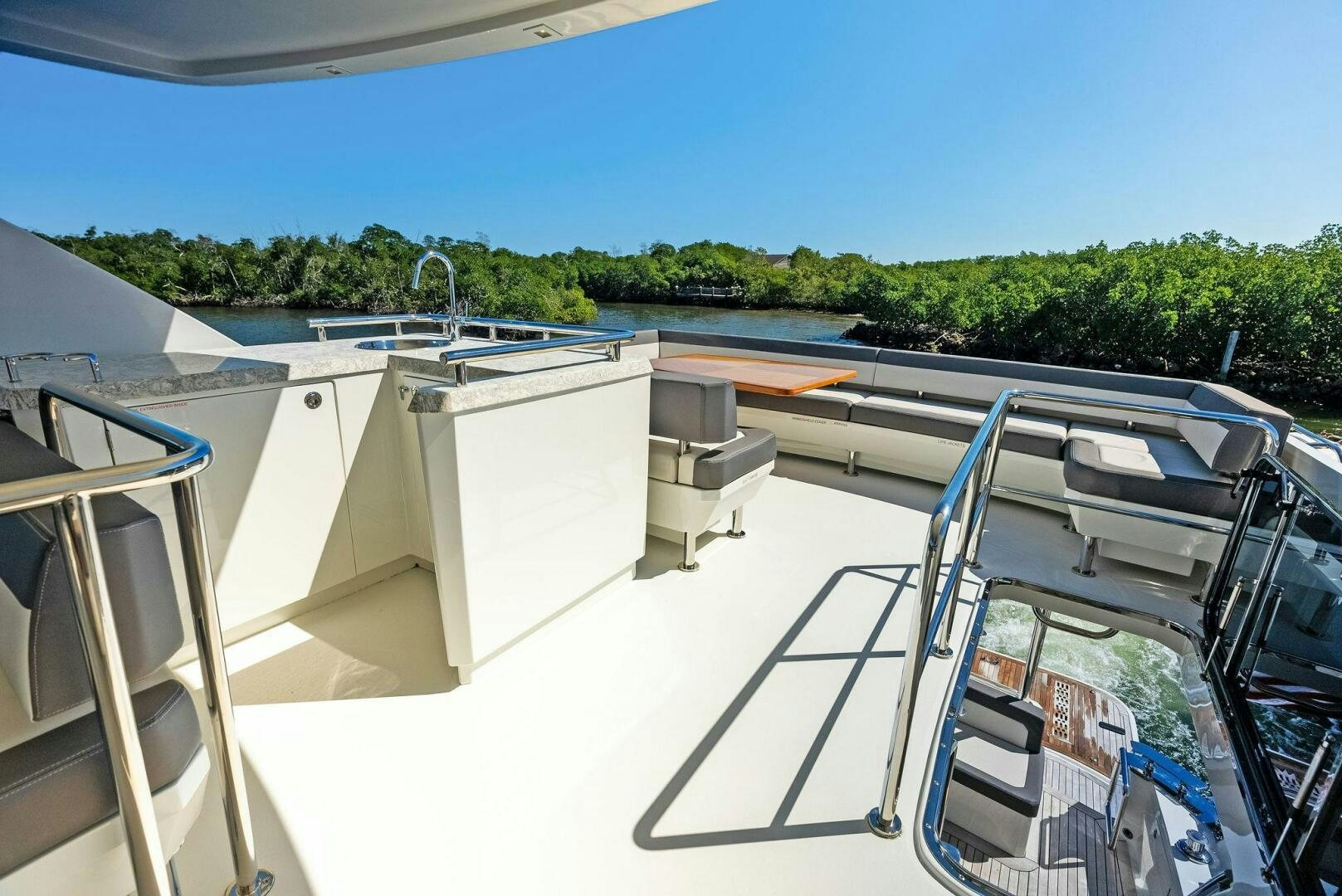 a large white boat on a body of water aboard SUNNY SEAJAY Yacht for Sale