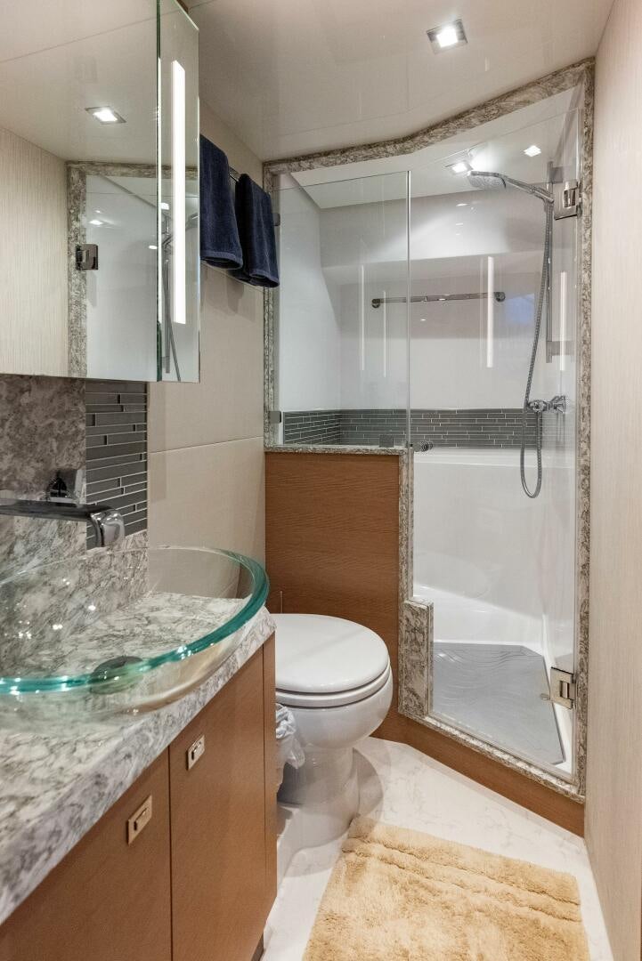 a bathroom with a glass shower aboard SUNNY SEAJAY Yacht for Sale