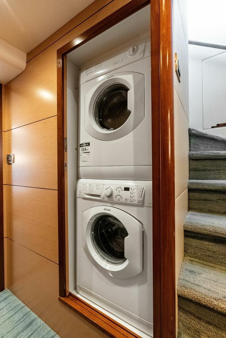a white washing machine aboard SUNNY SEAJAY Yacht for Sale