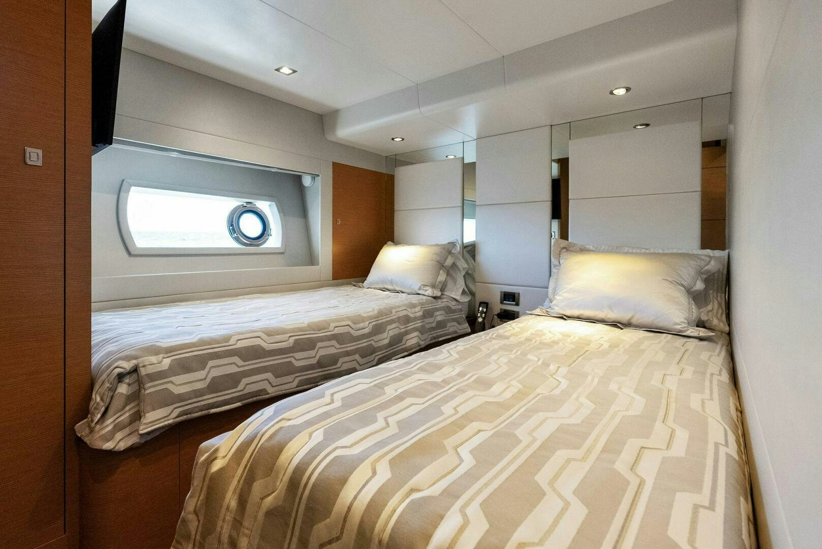 a bedroom with two beds aboard SUNNY SEAJAY Yacht for Sale