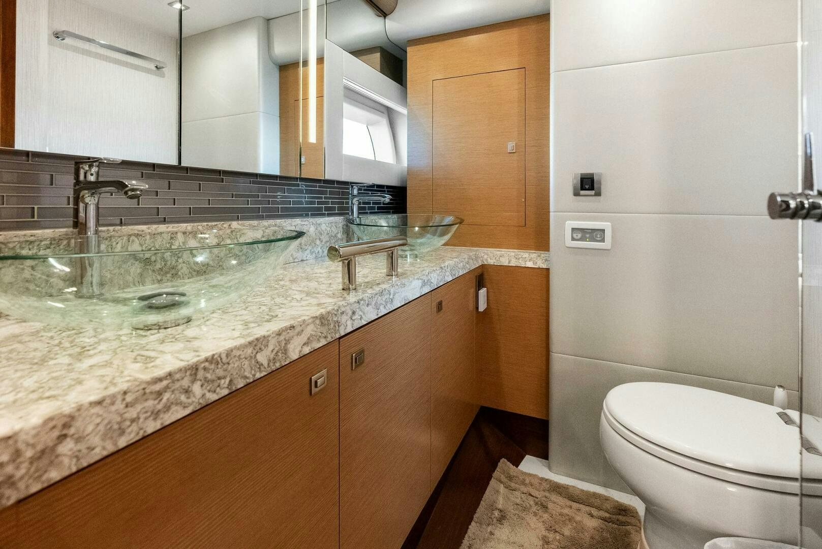 a bathroom with a marble counter top aboard SUNNY SEAJAY Yacht for Sale