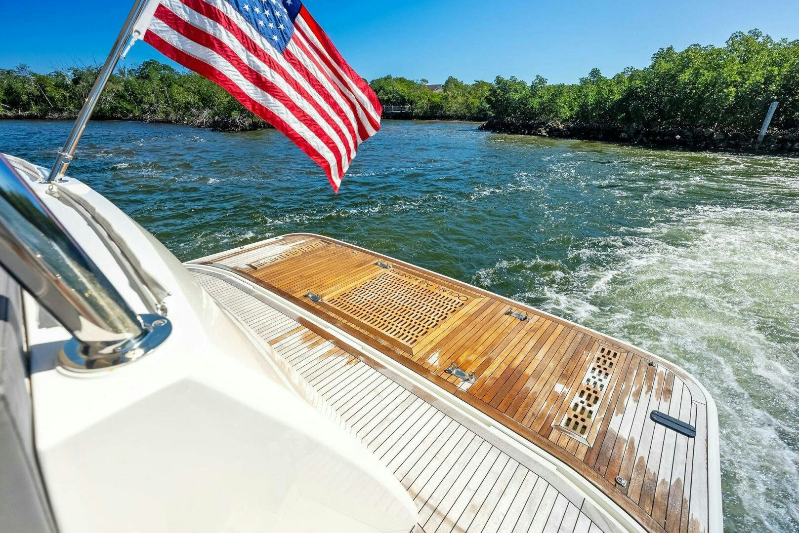 a boat with a flag on it aboard SUNNY SEAJAY Yacht for Sale