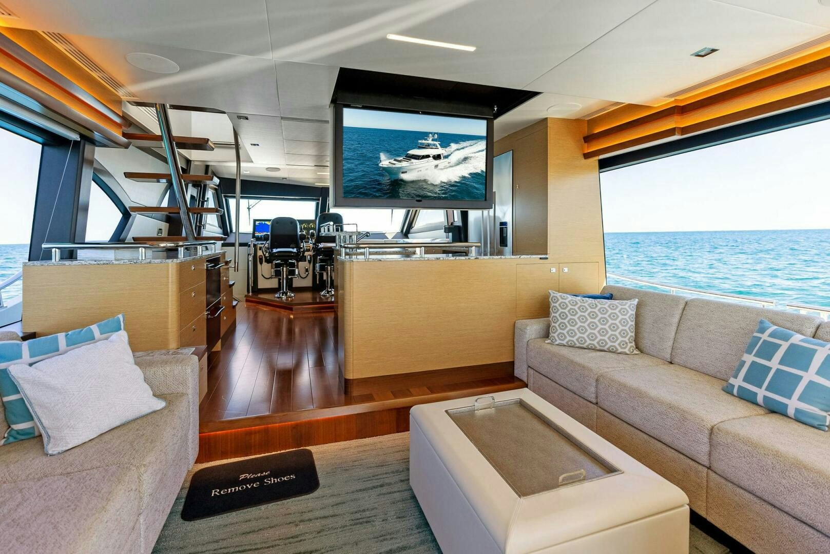 a living room with a large window aboard SUNNY SEAJAY Yacht for Sale