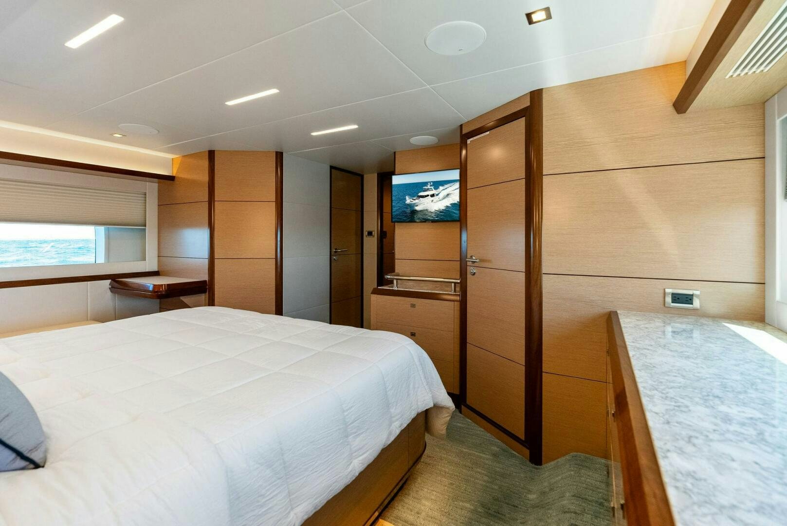a room with a bed and a television aboard SUNNY SEAJAY Yacht for Sale
