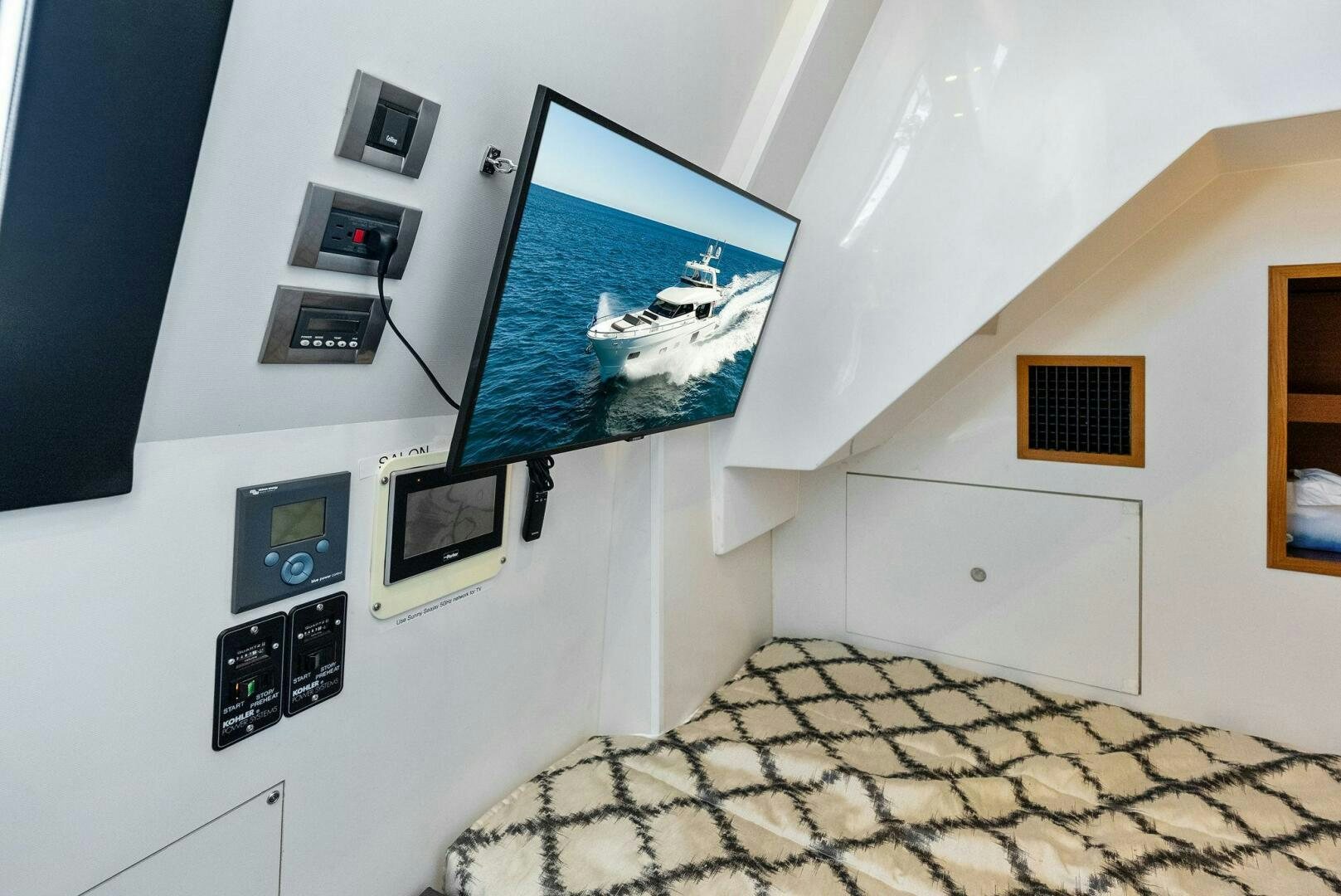 a room with a bed and a tv aboard SUNNY SEAJAY Yacht for Sale