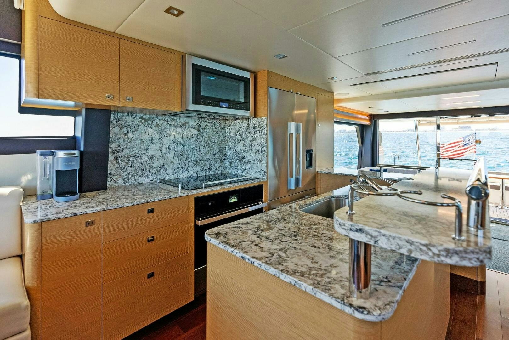 a kitchen with a large island aboard SUNNY SEAJAY Yacht for Sale