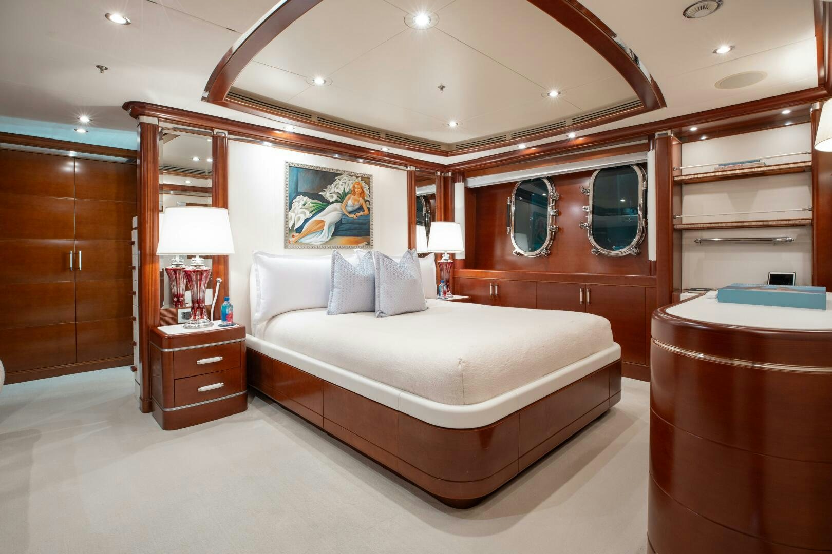 a bedroom with a bed and a mirror aboard Q Yacht for Sale