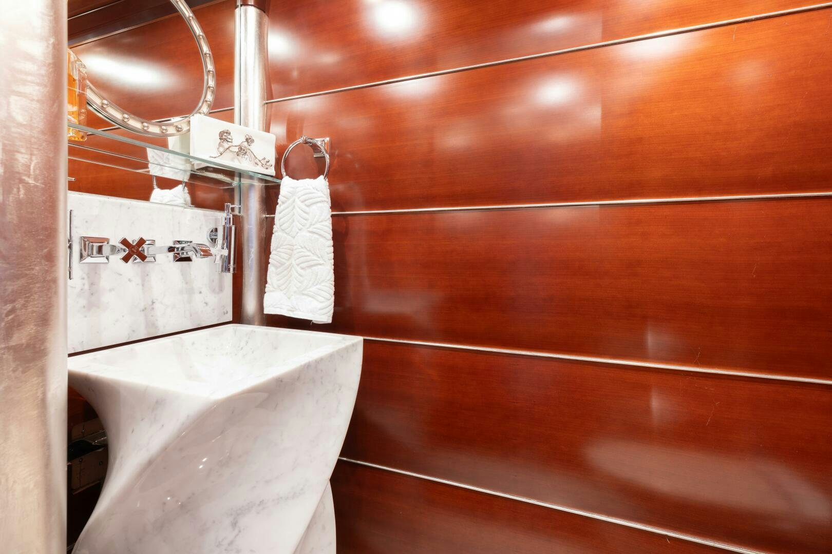 a bathroom with a bathtub and sink aboard Q Yacht for Sale