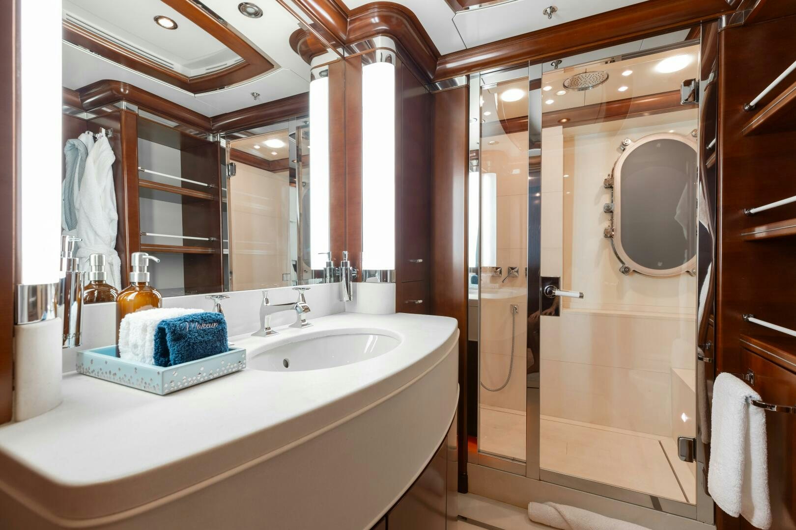 a bathroom with a large mirror aboard Q Yacht for Sale