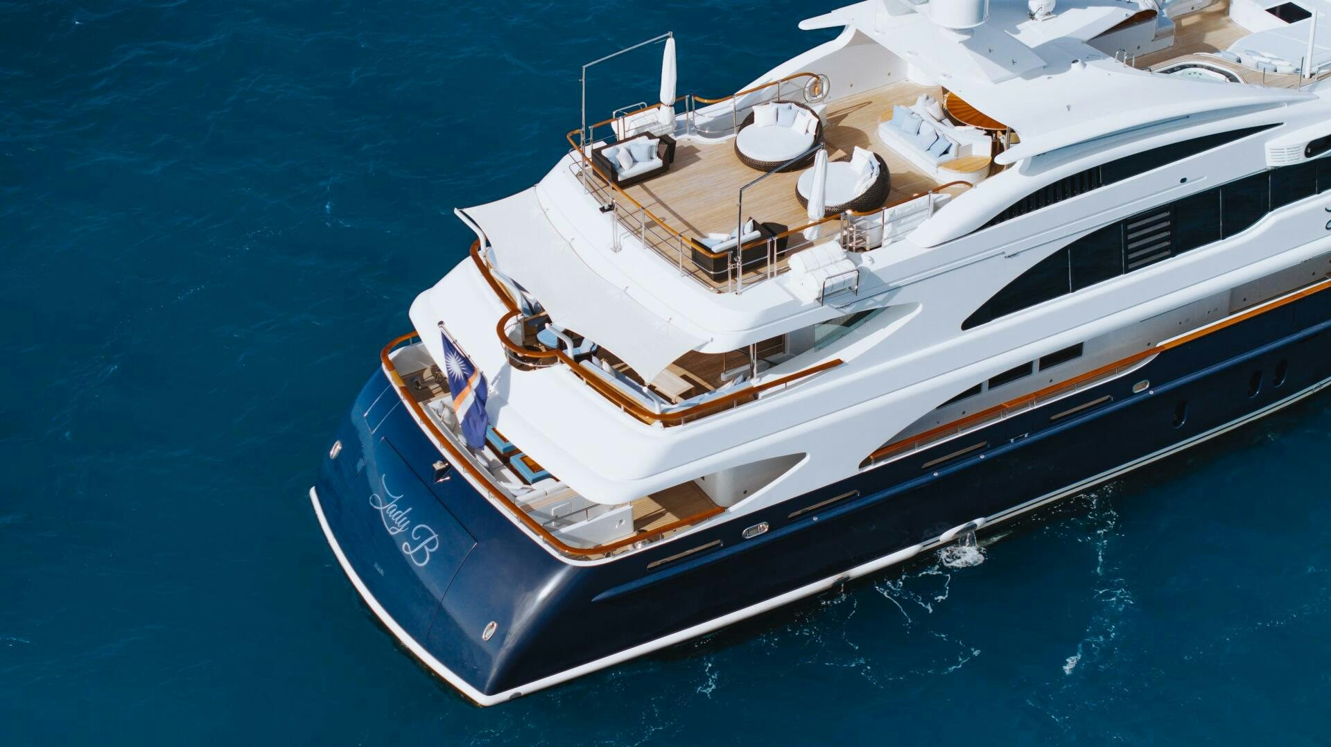 a large white boat in the water aboard Q Yacht for Sale