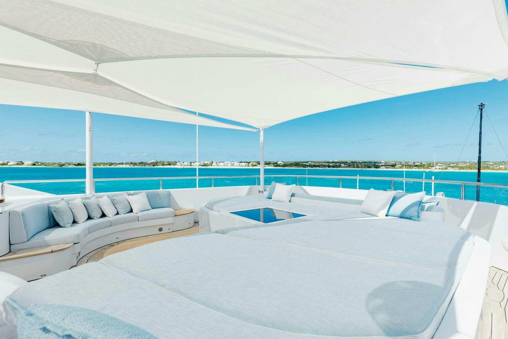 a room with a bed and a pool aboard Q Yacht for Sale