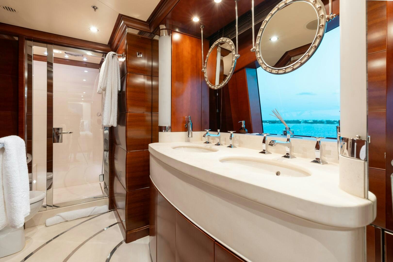 a bathroom with a large mirror aboard Q Yacht for Sale