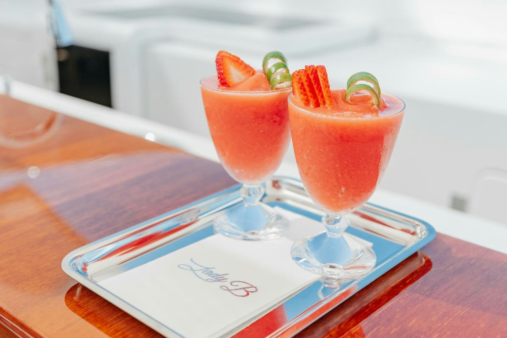 a group of drinks on a table aboard Q Yacht for Sale