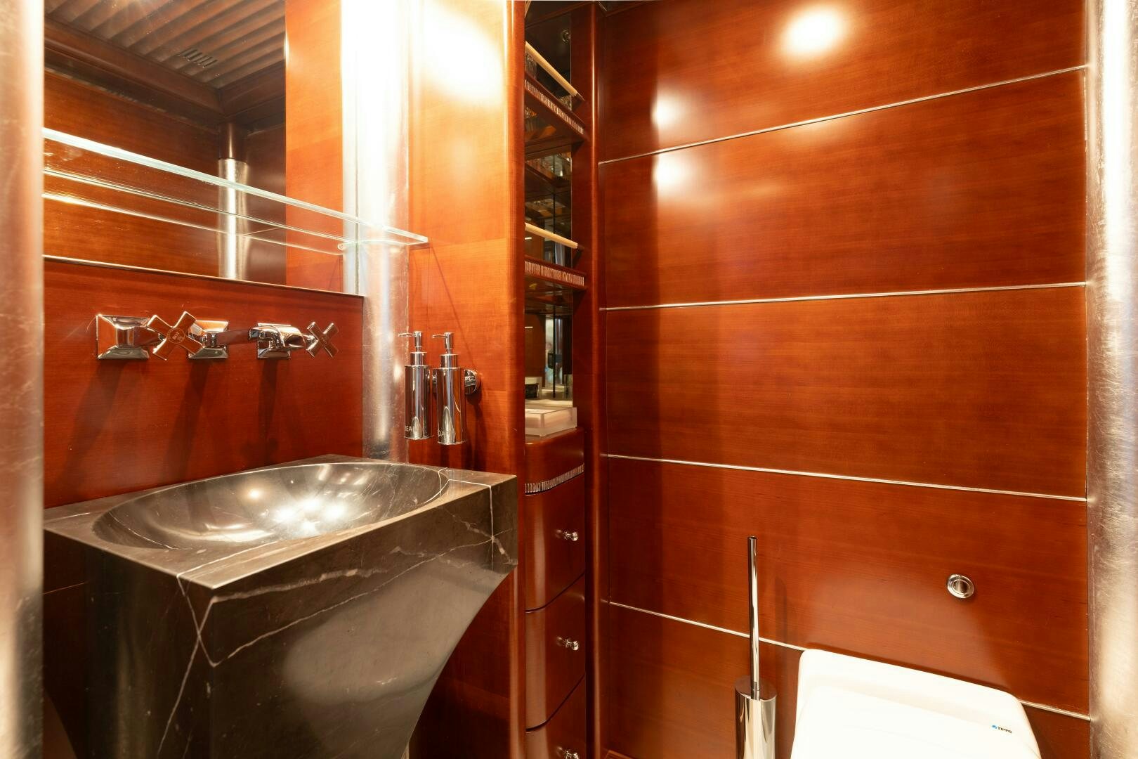 a bathroom with a sink and a mirror aboard Q Yacht for Sale