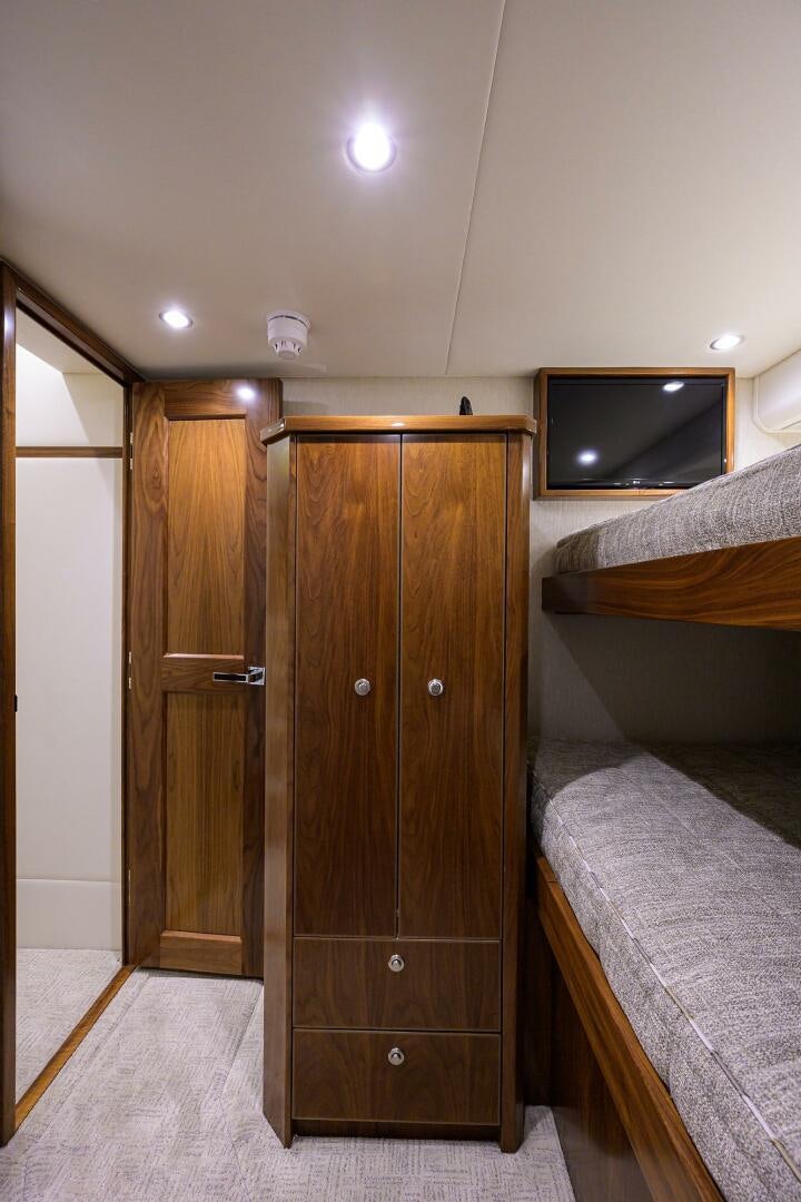 a room with a tv and a bed aboard SNOWBIRD Yacht for Sale