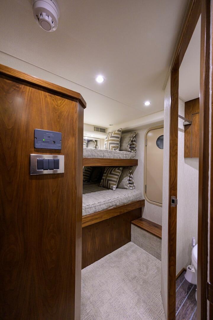 a bathroom with a bed and a closet aboard SNOWBIRD Yacht for Sale