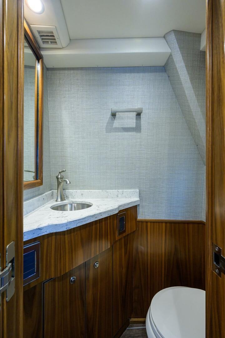 a bathroom with a sink and a toilet aboard SNOWBIRD Yacht for Sale